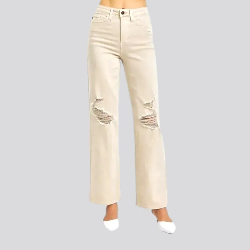 Distressed women's sand jeans